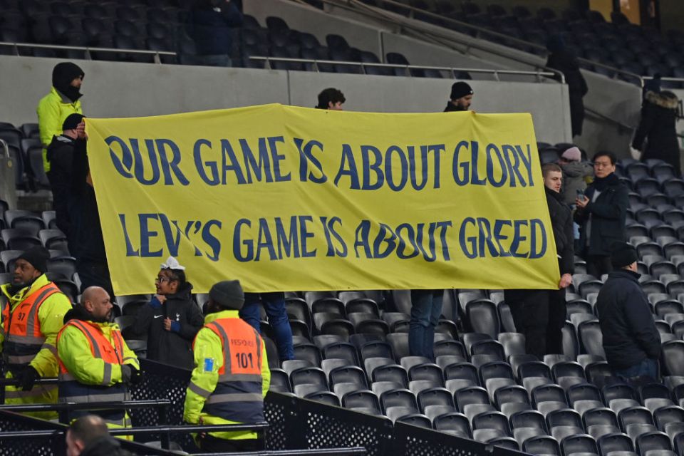 Tottenham fans hold up a banner with a message against the owners of the club after the English Premier League football match between Tottenham Hotspur and Manchester United at the Tottenham Hotspur Stadium in London, on February 16, 2025. Tottenham won the game 1-0. (Photo by Glyn KIRK / AFP) / RESTRICTED TO EDITORIAL USE. No use with unauthorized audio, video, data, fixture lists, club/league logos or 'live' services. Online in-match use limited to 120 images. An additional 40 images may be used in extra time. No video emulation. Social media in-match use limited to 120 images. An additional 40 images may be used in extra time. No use in betting publications, games or single club/league/player publications. /  (Photo by GLYN KIRK/AFP via Getty Images)
