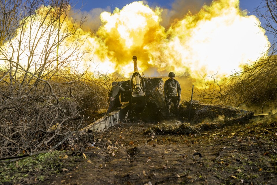 Ukrainian soldiers firing artillery near Bakhmut.