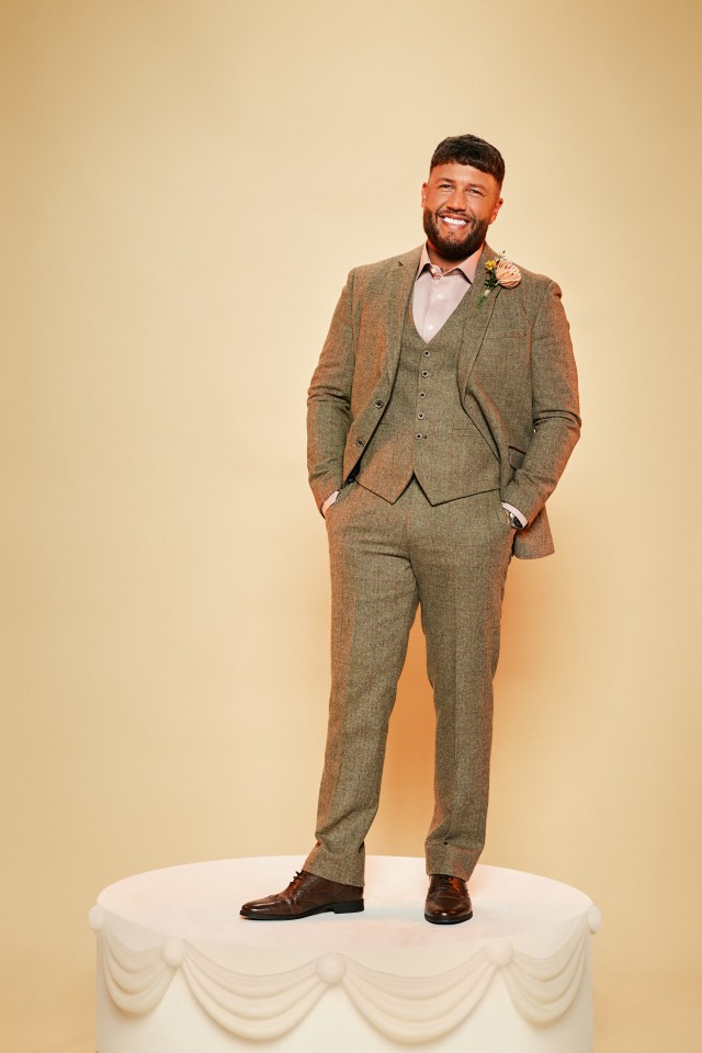 Adam in a brown suit.