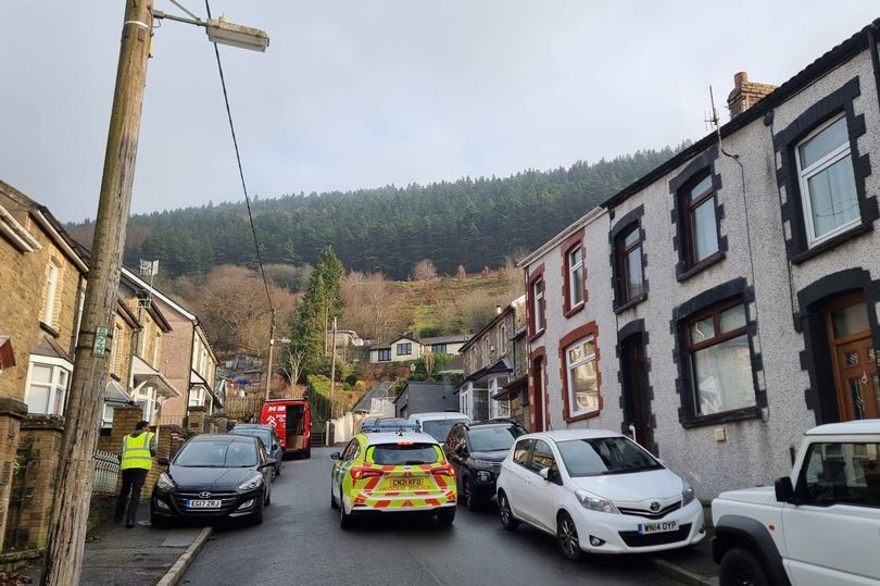 Emergency vehicles on a residential street.