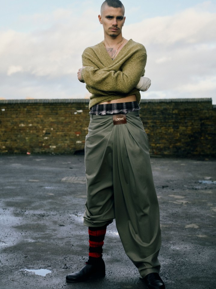 Man in Loewe pants and sweater.