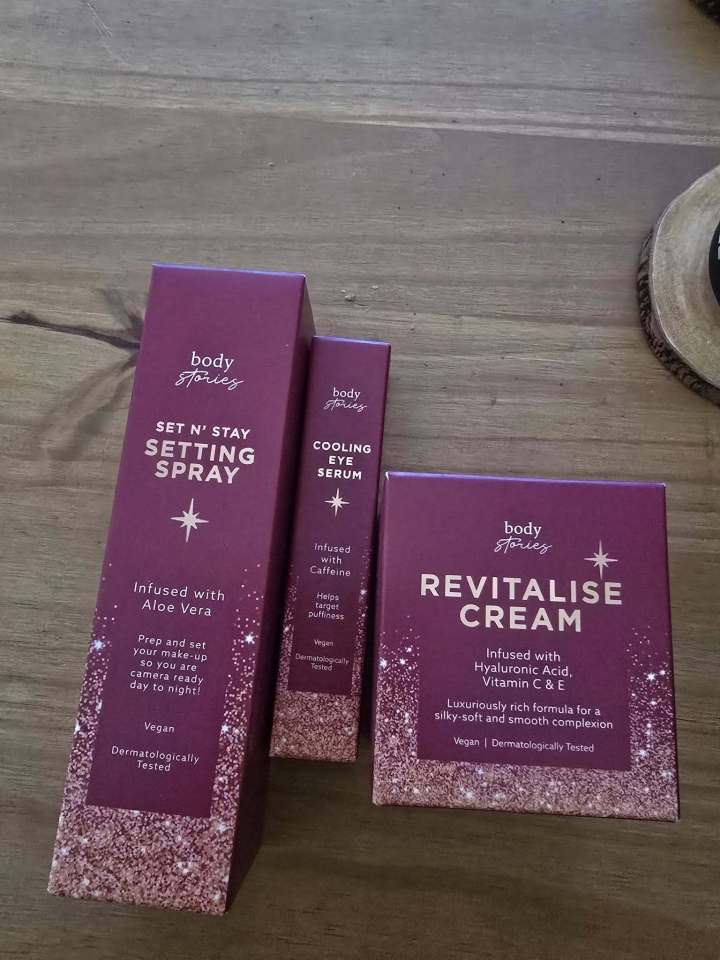 Body Stories skincare products: setting spray, eye serum, and revitalizing cream.