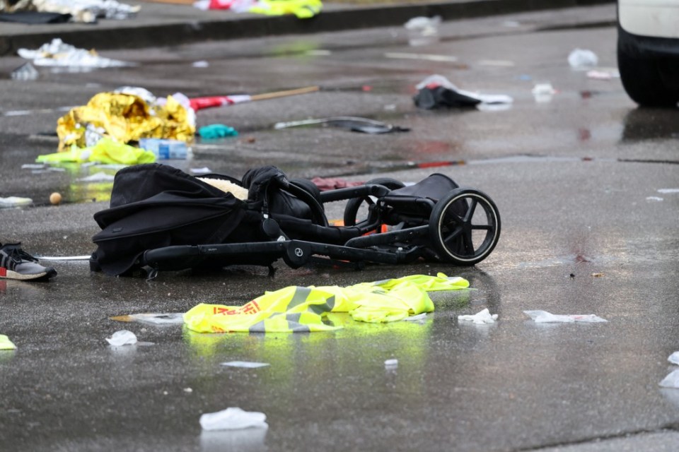 A pram lies on the road beside a car that drove into a crowd in Munich, Germany, February 13, 2025, injuring several people. REUTERS/Wolfgang Rattay