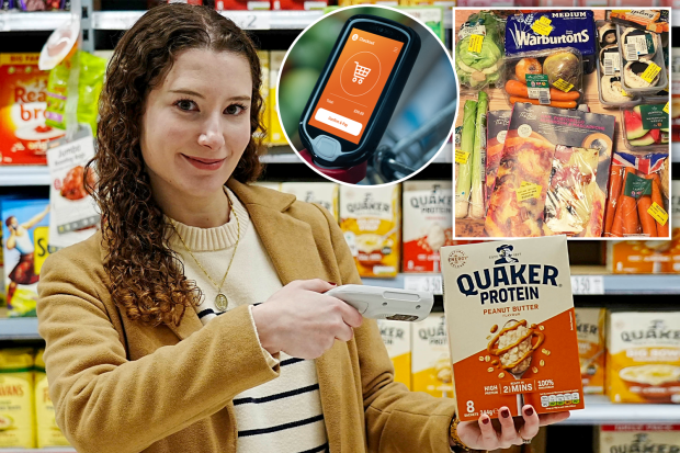 Woman using a handheld scanner to checkout groceries in a supermarket.