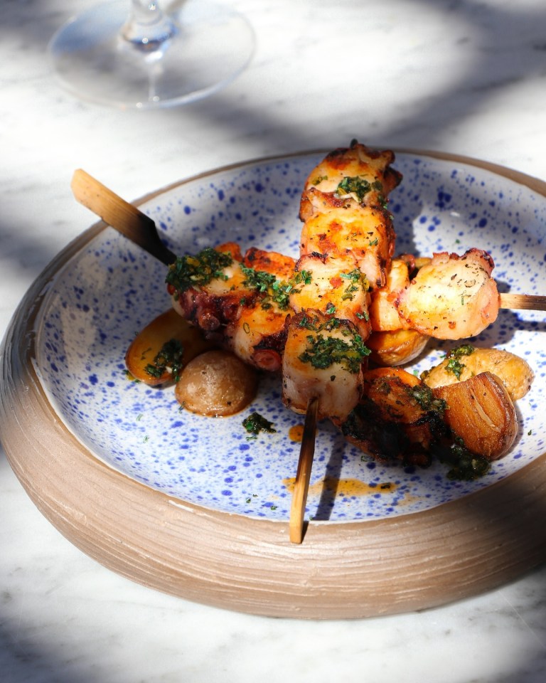 Grilled octopus and potatoes on skewers.