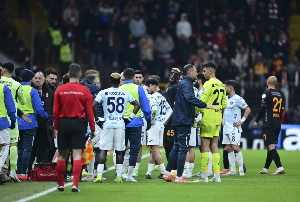 Adana Demirspor soccer team leaving the field.