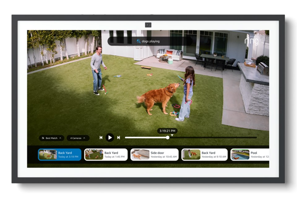 Ring video display showing a family playing with their dog in the backyard.