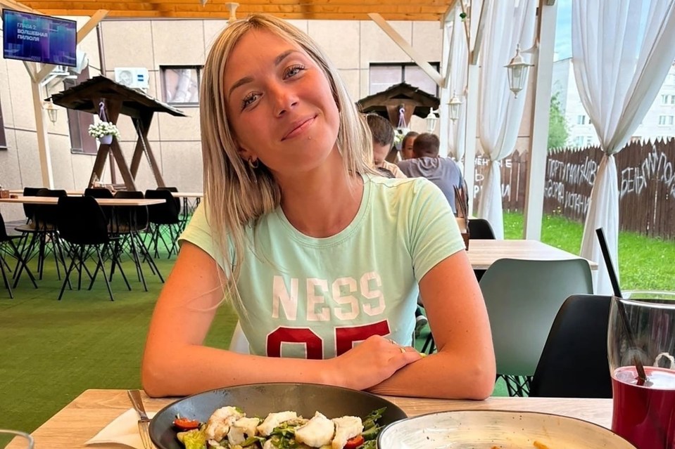 Anastasia Barbakar, 32, posing at a restaurant.