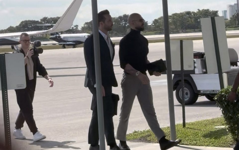 Andrew Tate and Tristan Tate walking from a private jet in Florida.