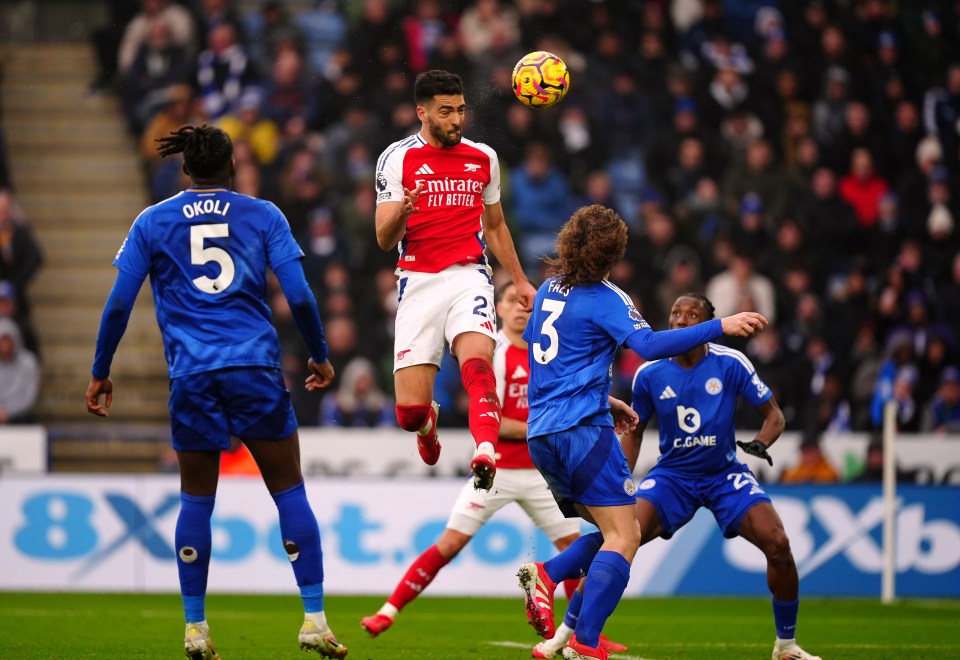 Mikel Merino scoring a header during a soccer game.