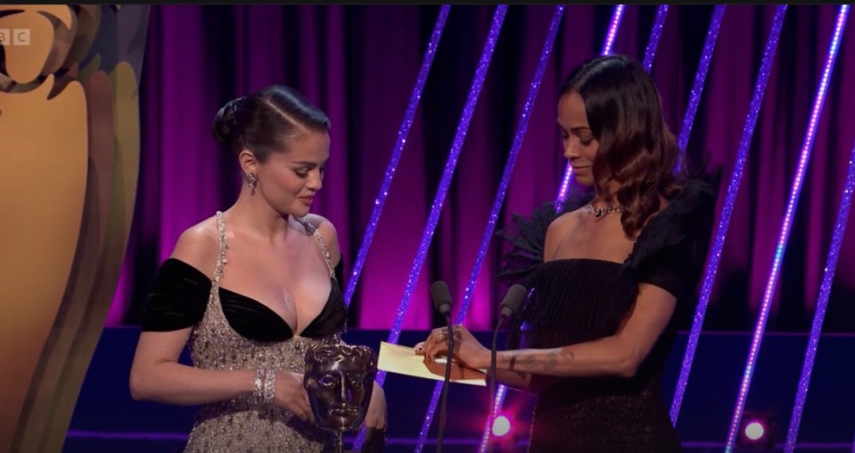 Selena Gomez accepting an award.
