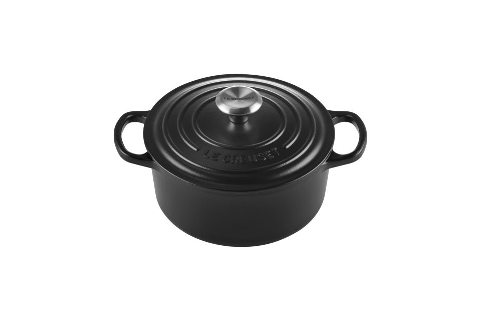 Black Le Creuset cast iron pot with lid.