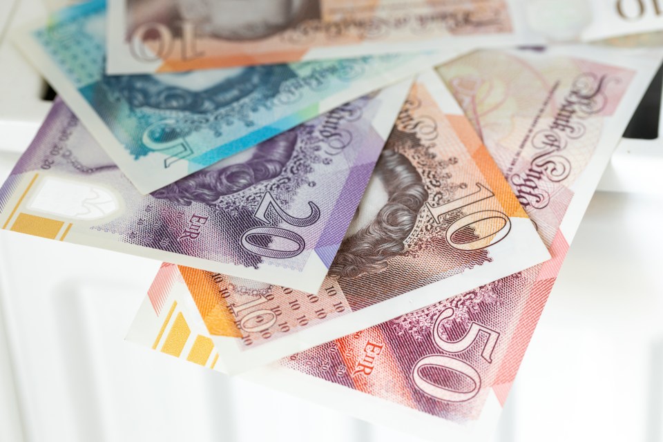 British pound notes on a surface.