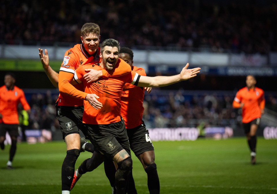 Sheffield Wednesday players celebrating a goal.