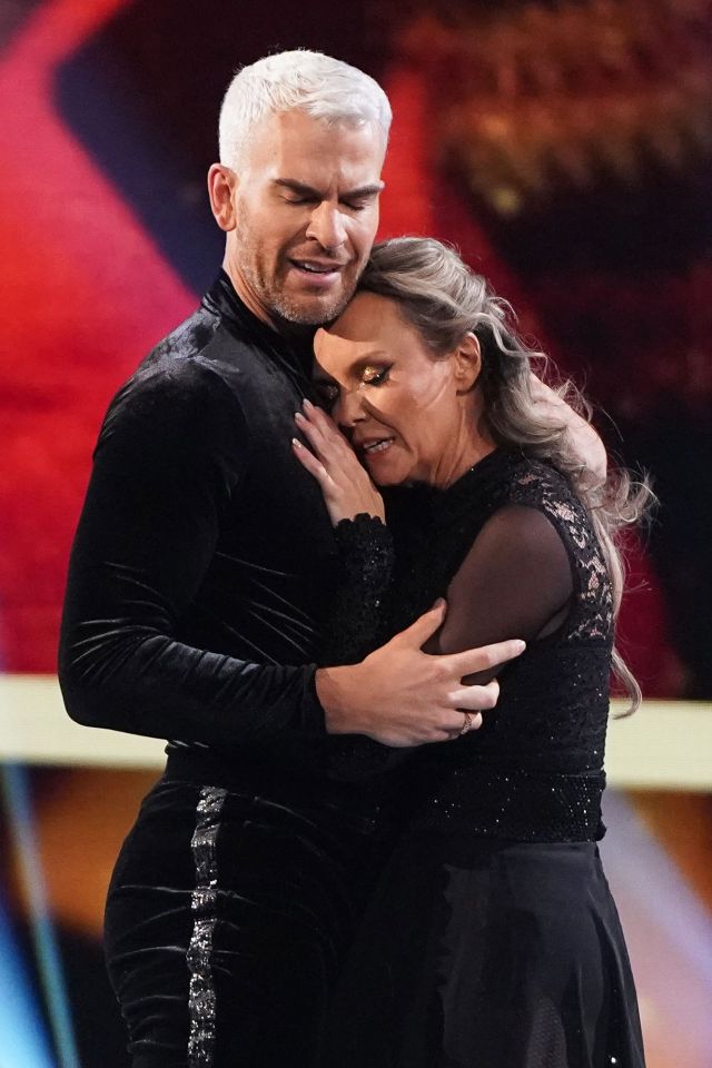 Charlie Brooks and Eric Radford embracing on Dancing on Ice.