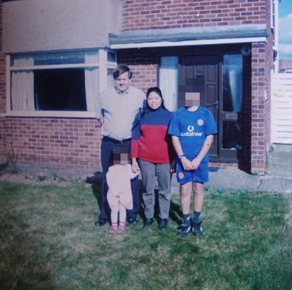 Family photo in front of their home.