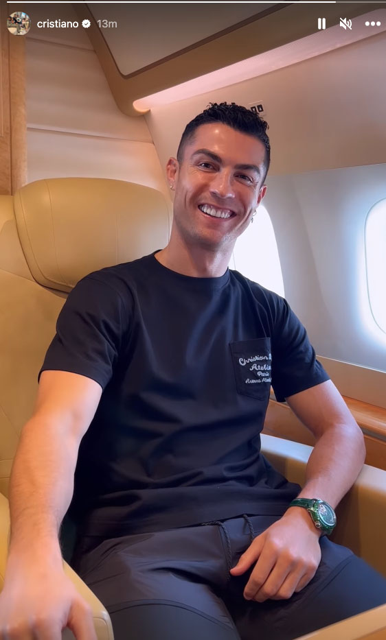 Cristiano Ronaldo smiling on a private jet.