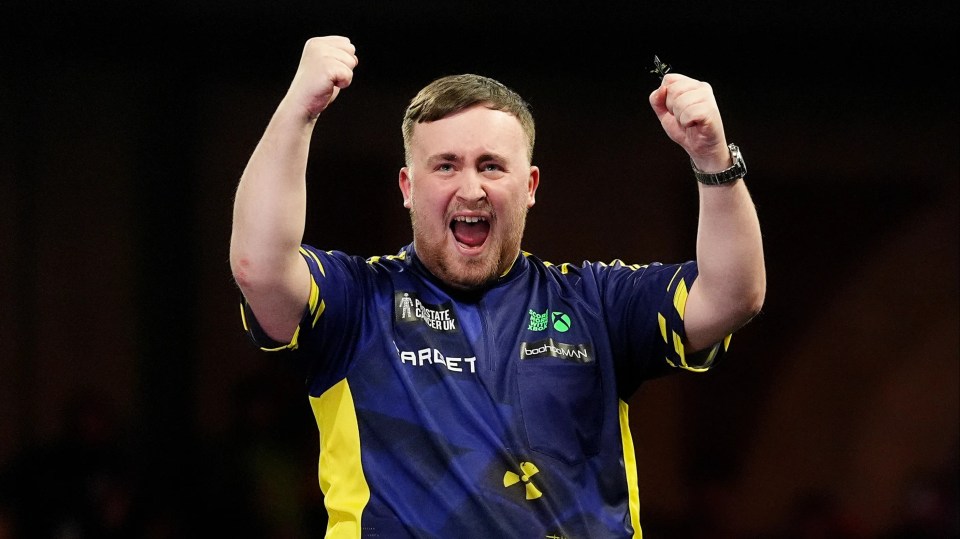 Luke Littler celebrates winning the Paddy Power World Darts Championship.