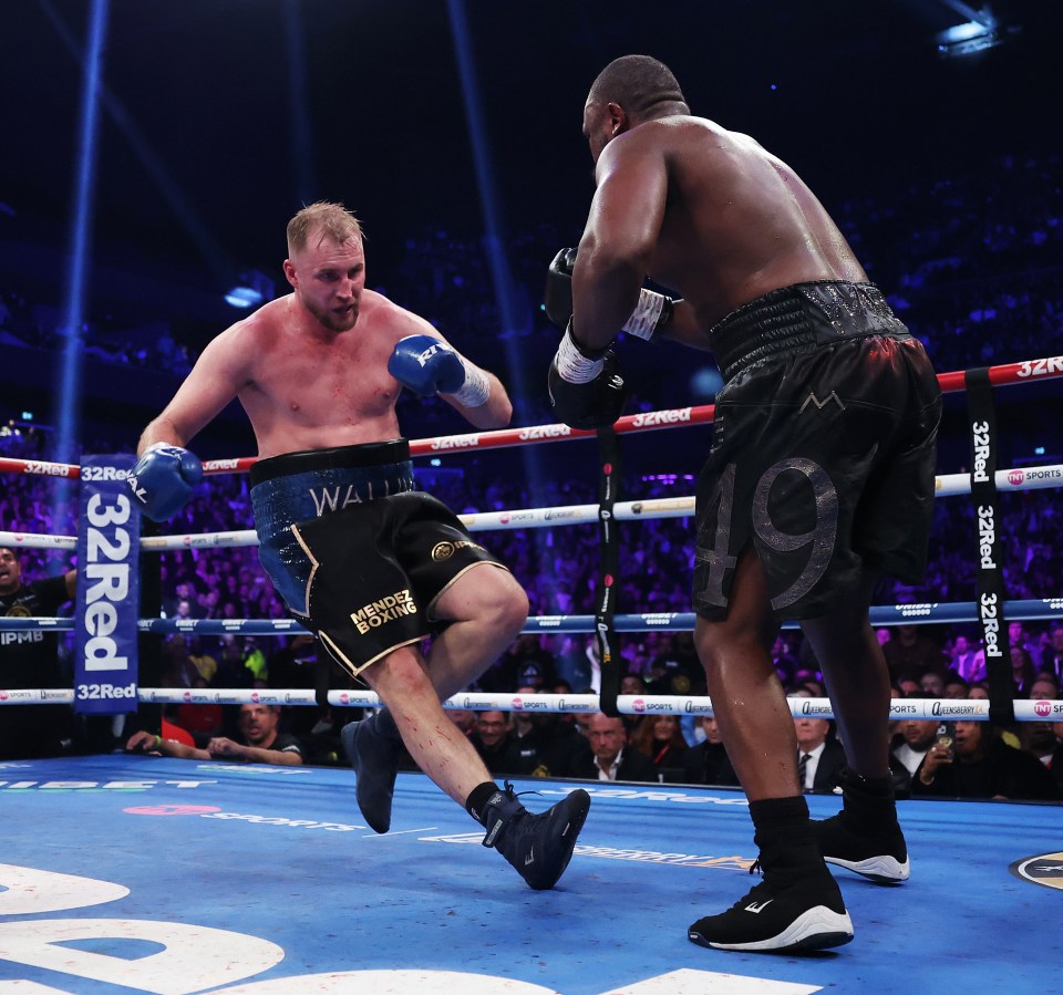 Derek Chisora knocking down Otto Wallin in a boxing match.