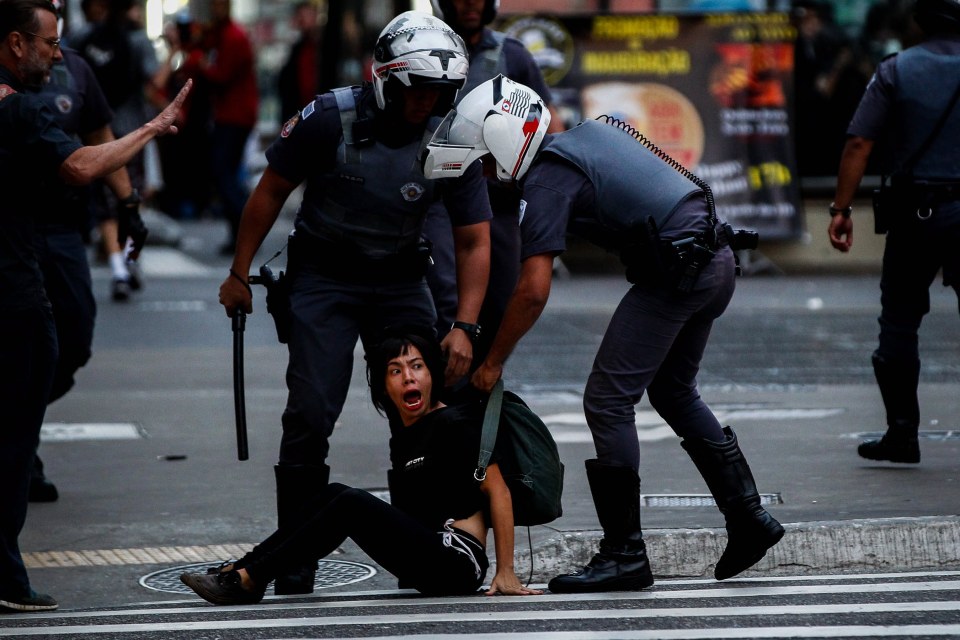 Police detaining a demonstrator during a strike in Sao Paulo, Brazil.