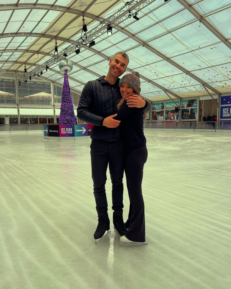 Couple embracing on an ice rink.