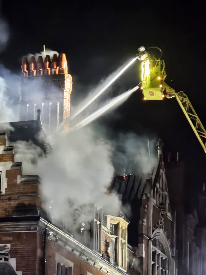 Firefighters battling a blaze at a building.