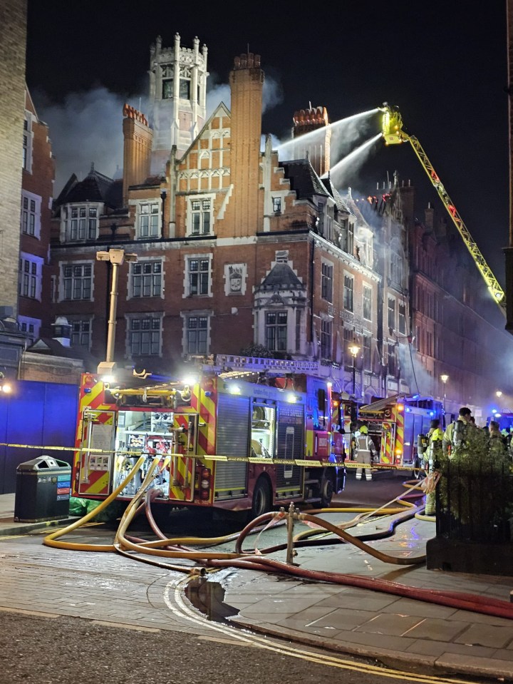 Firefighters battling a blaze at a building.