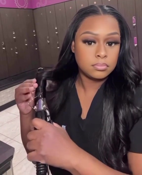 Woman styling her hair in a locker room, text overlay: "Why I choose to be homeless"