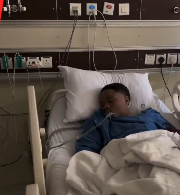 Person sleeping in a hospital bed.