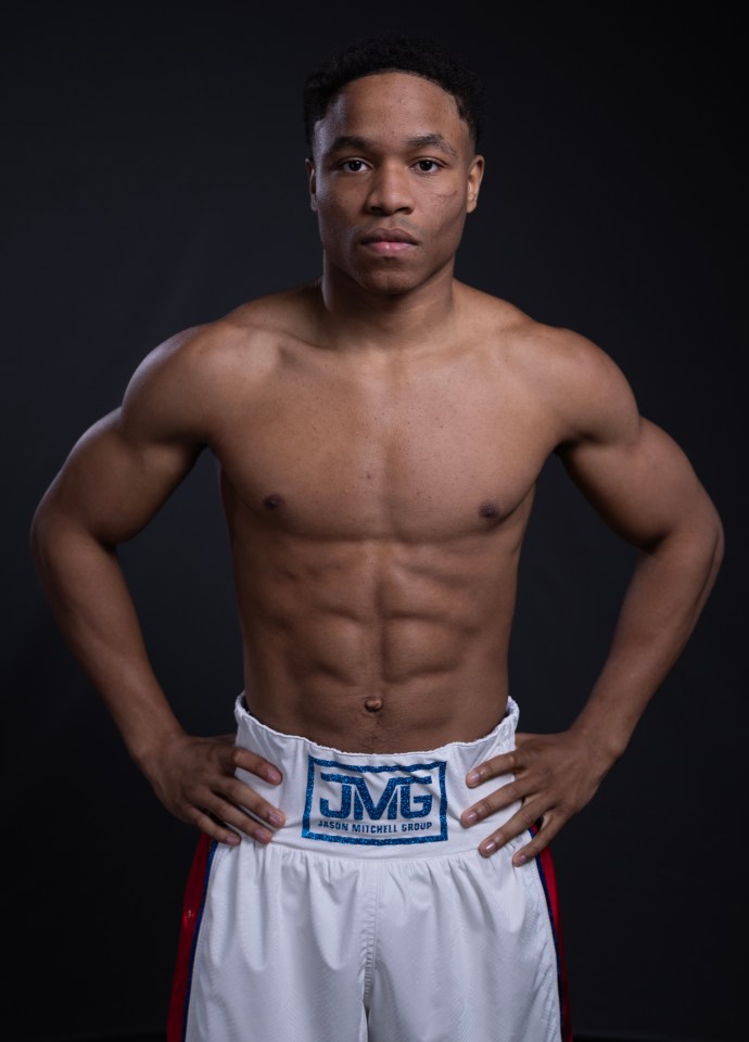 Portrait of Floyd Schofield, a boxer, wearing white boxing shorts.