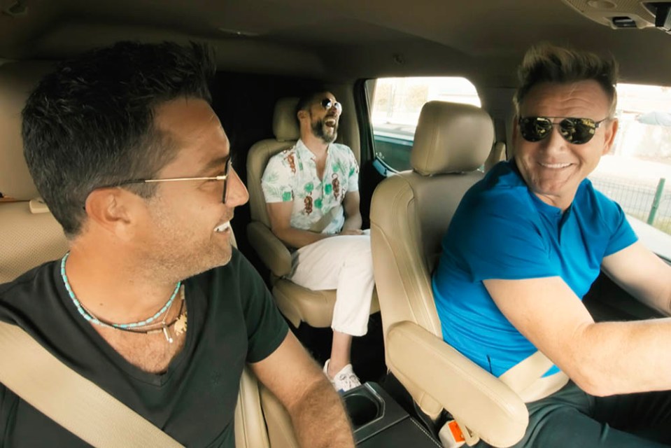 Gordon Ramsay, Gino D’Acampo, and Fred Sirieix laughing in a car.