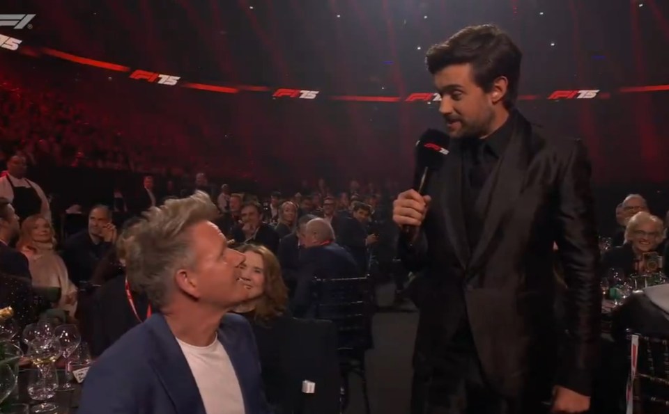 Gordon Ramsay being interviewed at an F1 event.