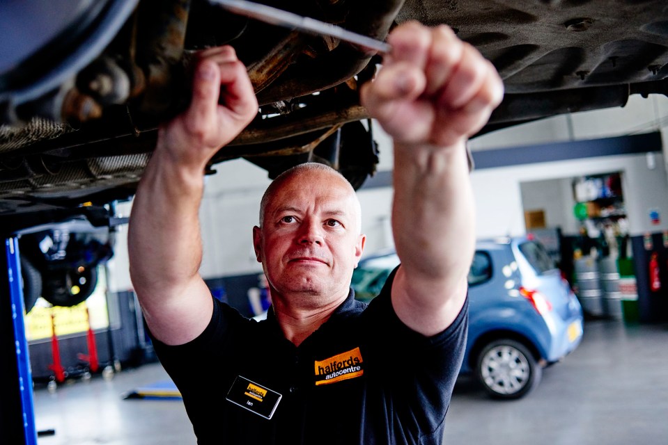 Mechanic working under a car.