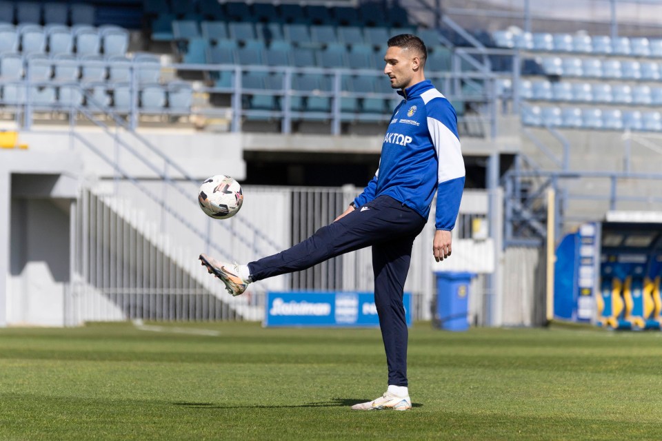 Soccer player juggling a ball.