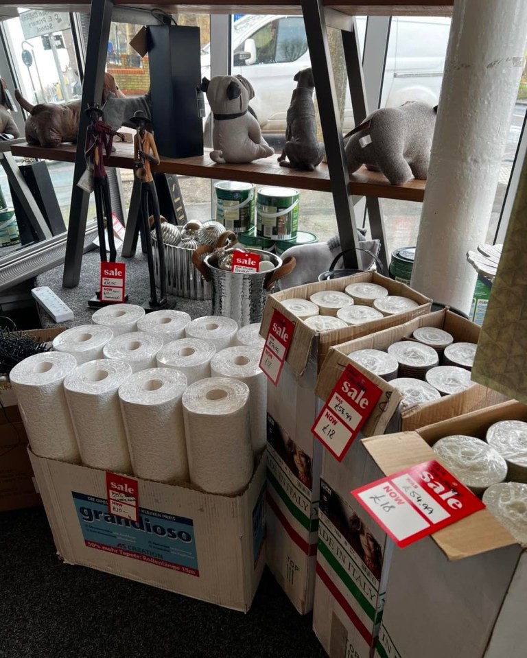 Sale of wallpaper rolls in boxes.