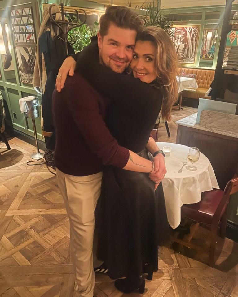 Kym Marsh and Samuel Thomas embracing.