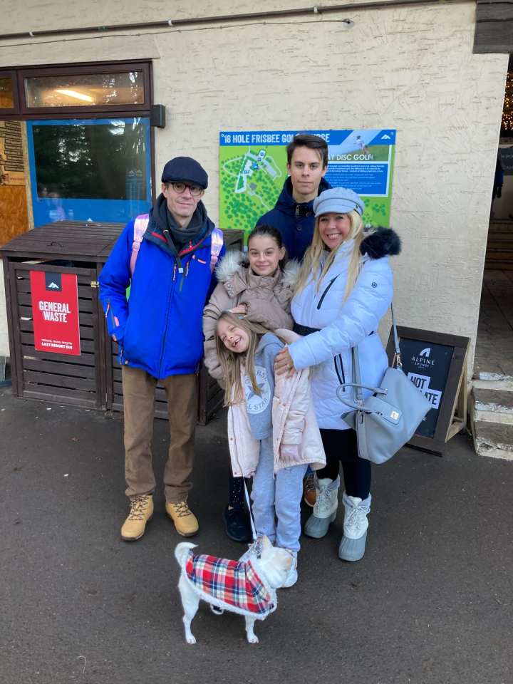 Family photo in front of a building.