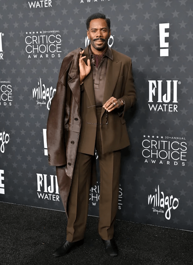Man in brown suit at Critics Choice Awards.