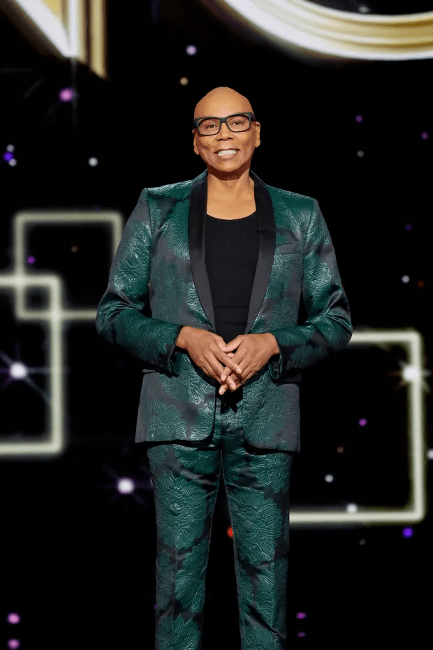 RuPaul in a green floral suit.