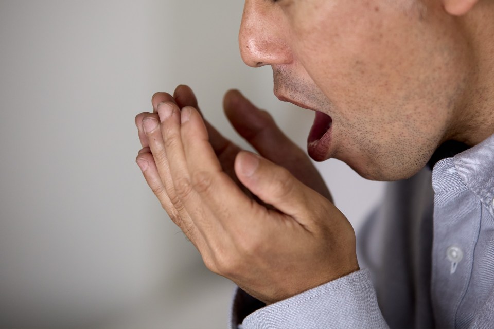 A Japanese man worried about his bad breath.