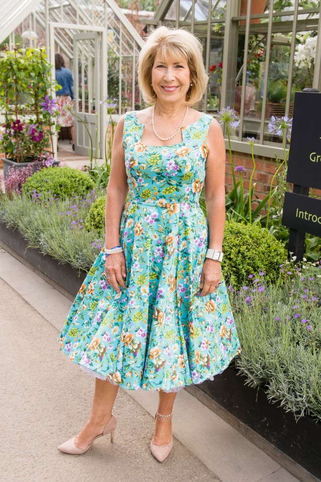 Jennie Bond at the Chelsea Flower Show in a floral dress.