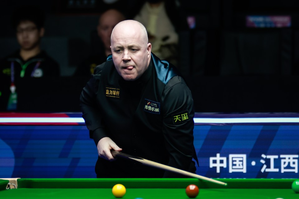 John Higgins of Scotland playing snooker.
