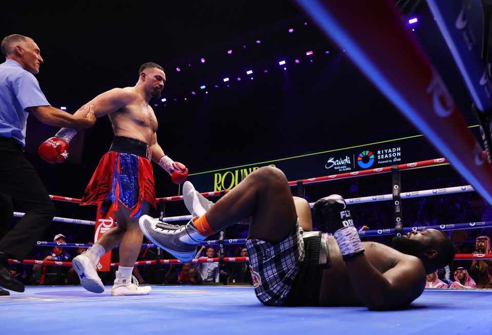 Joseph Parker knocking out Martin Bakole in a boxing match.