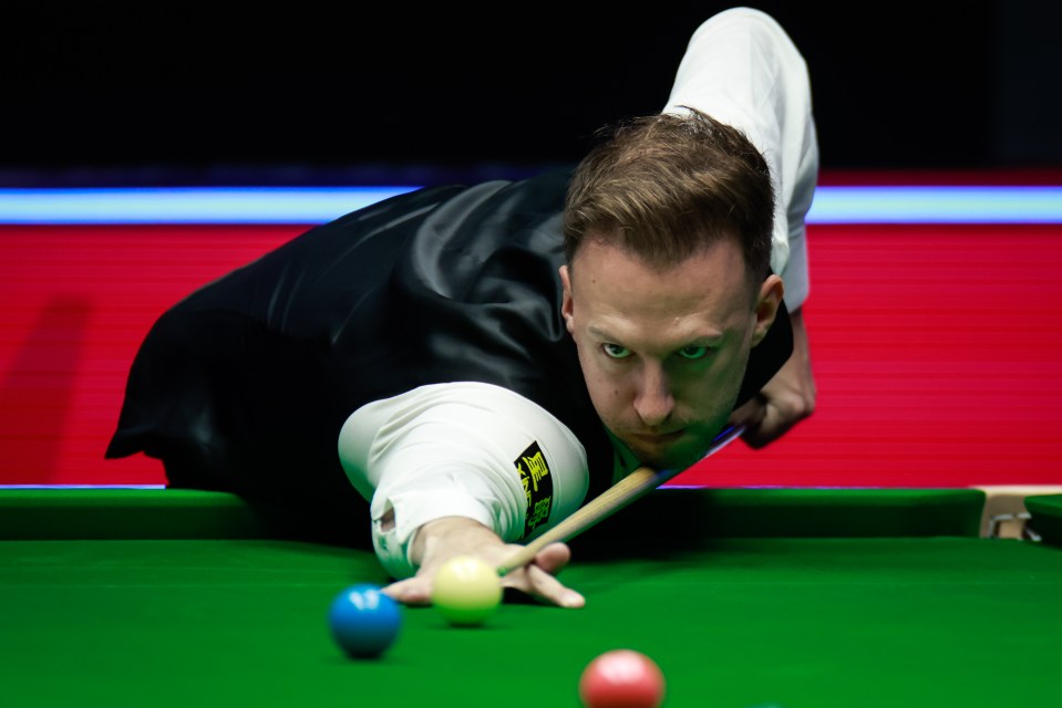 Judd Trump of England playing snooker.