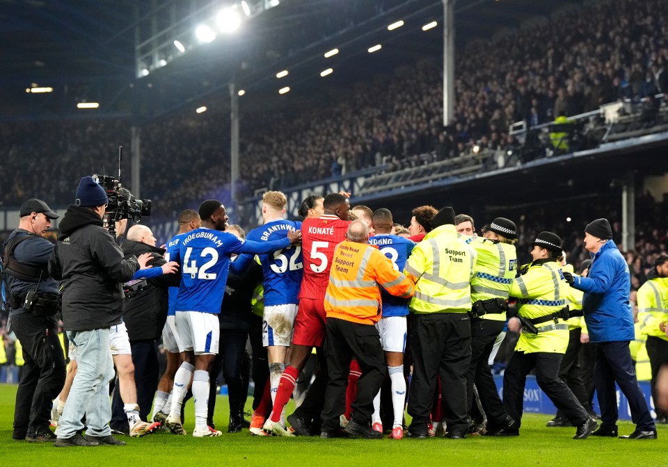 Liverpool's Curtis Jones and Everton's Abdoulaye Doucoure separated by officials after a clash.