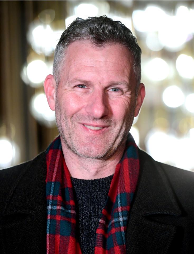 Adam Hills, MBE recipient for services to Paralympic sport and disability awareness.
