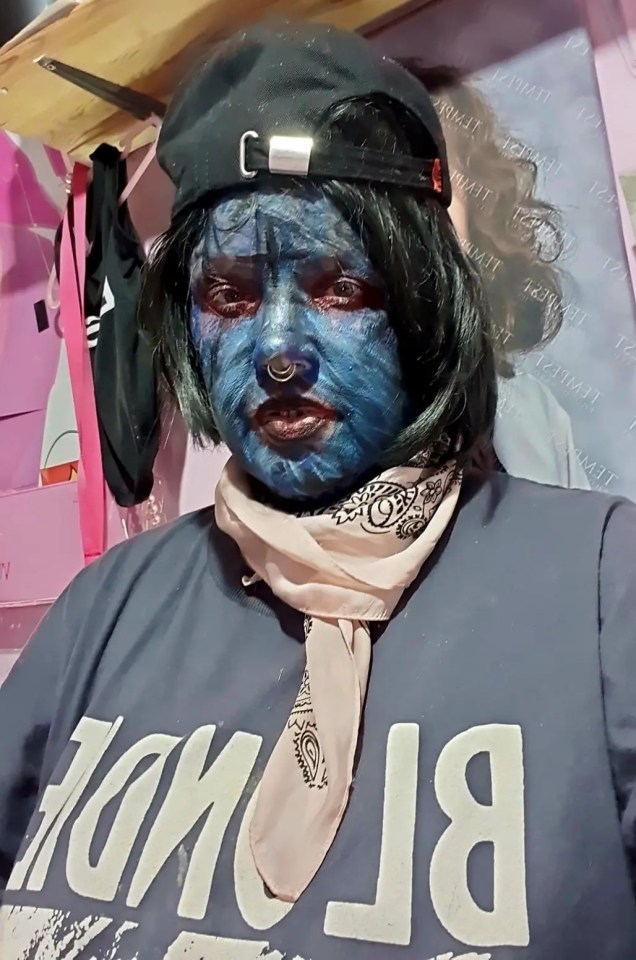 Close-up of a heavily tattooed woman's face.