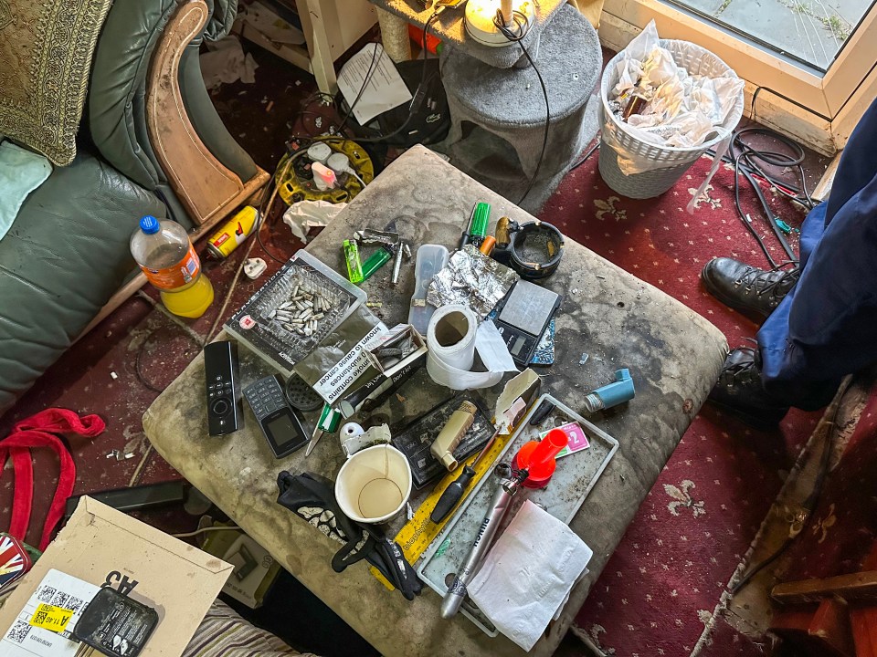 Messy room with drug paraphernalia following a police raid.