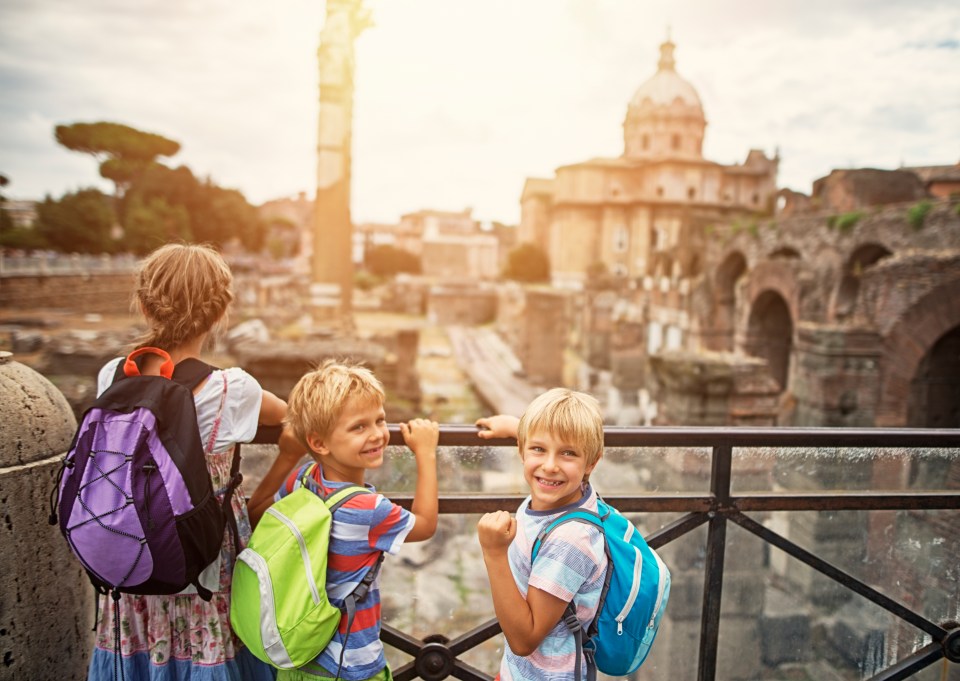 Mother and two children visiting the Roman Forum.