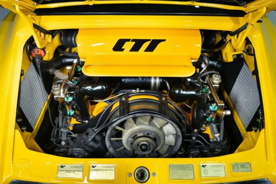 Yellow car engine with "CTR" label.